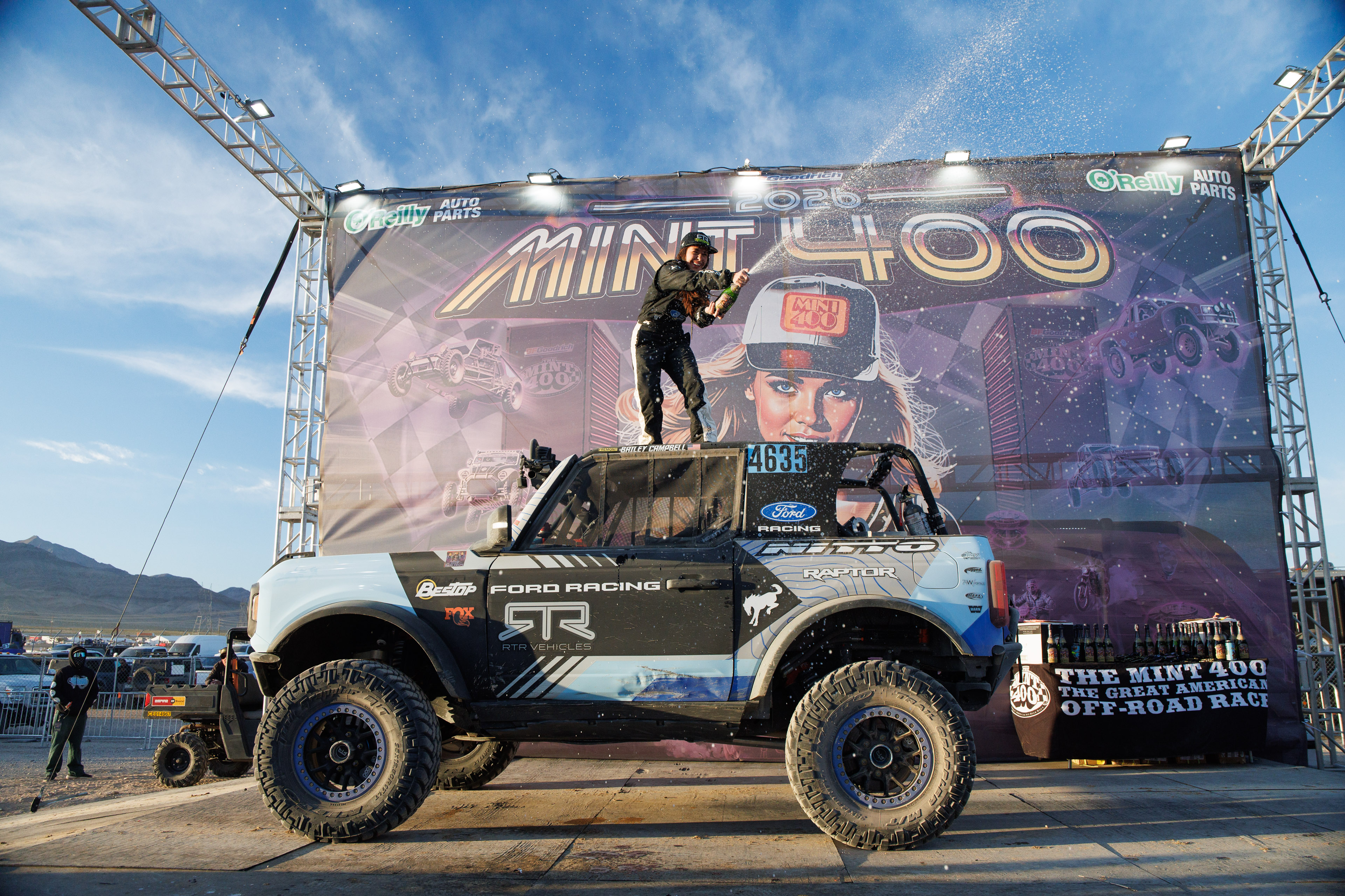 Mint 400 - Bailey Campbell sprays champagne from the roof of her Bronco Raptor 4600